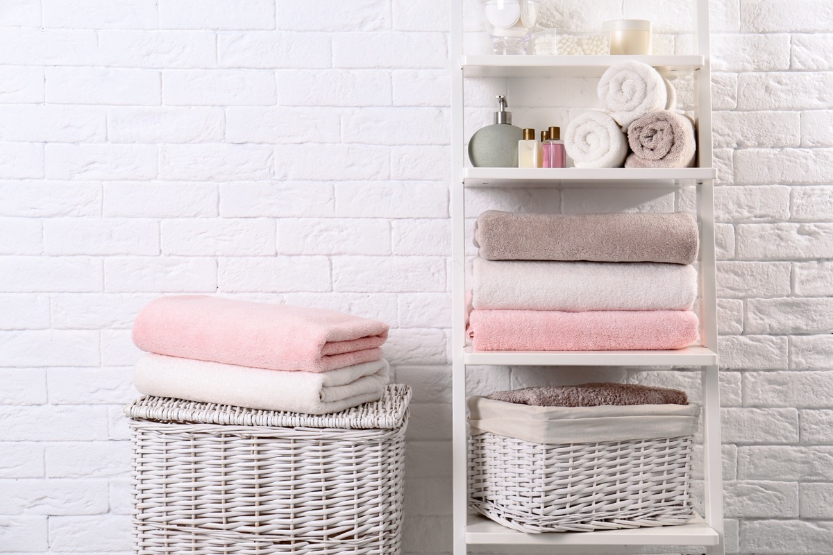 Bathroom shelves storage with pink towels