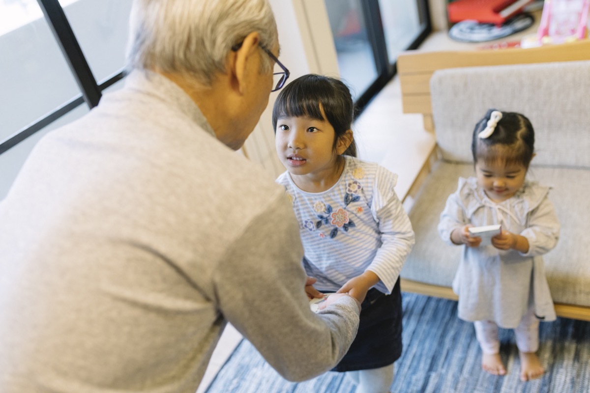 Grandfather talking to his granddaughter