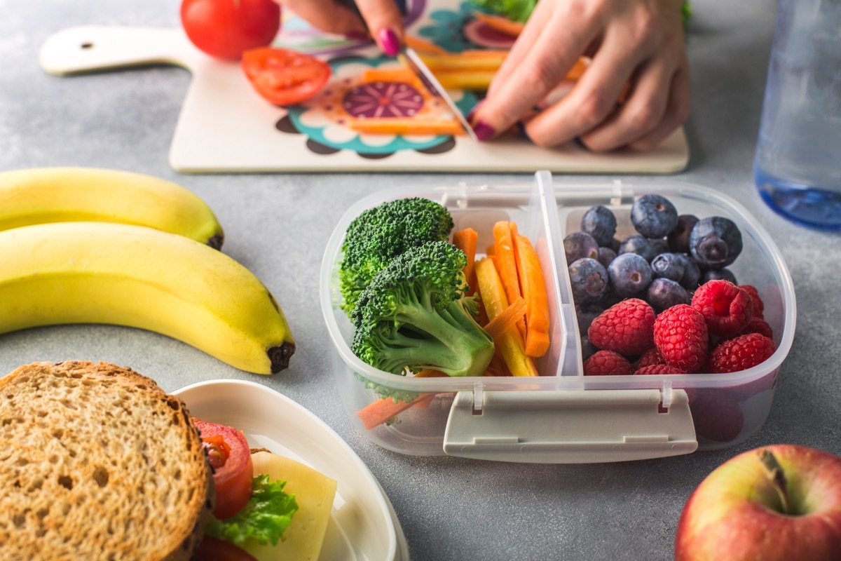 mother packing lunch for her child