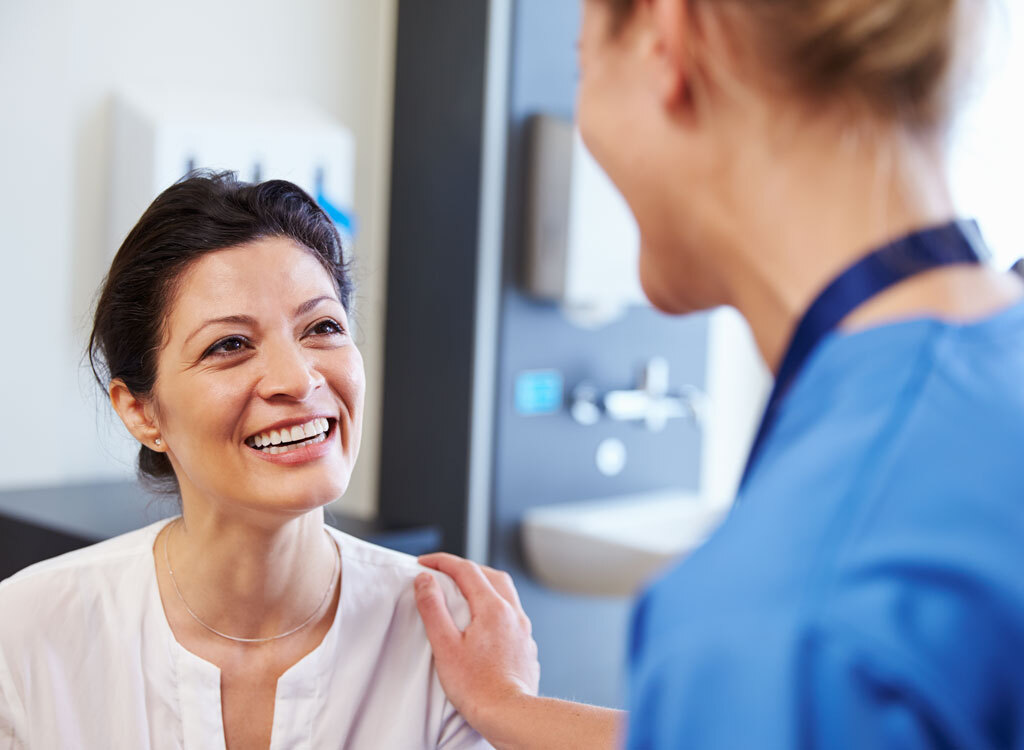 Woman talking to doctor