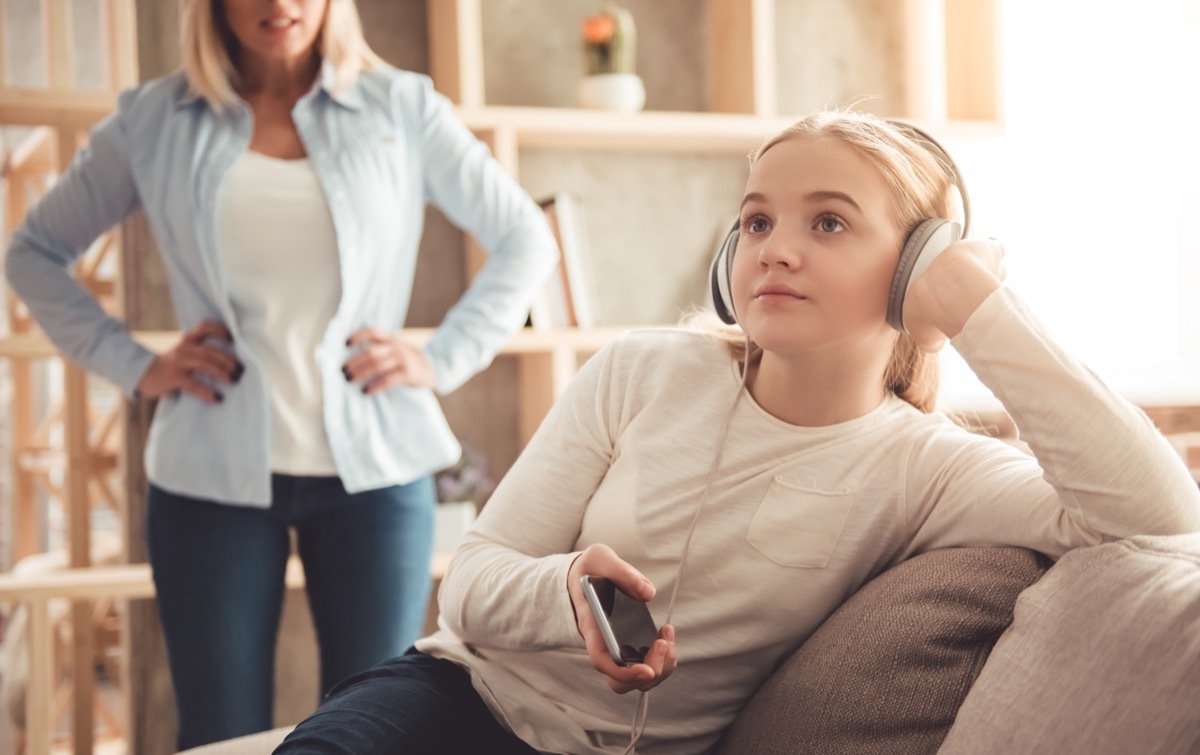 Teenager ignoring her mom who's trying to talk to her being a step-parent