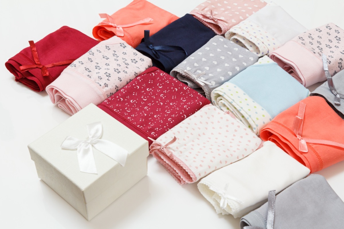 sets of folded women's underwear next to a gift box