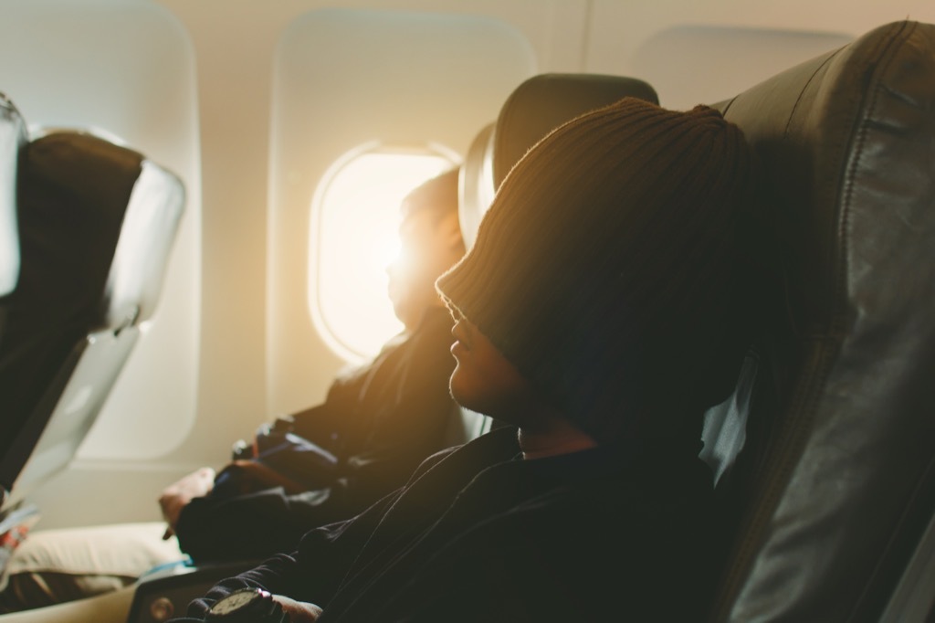 People sleeping on an airplane.