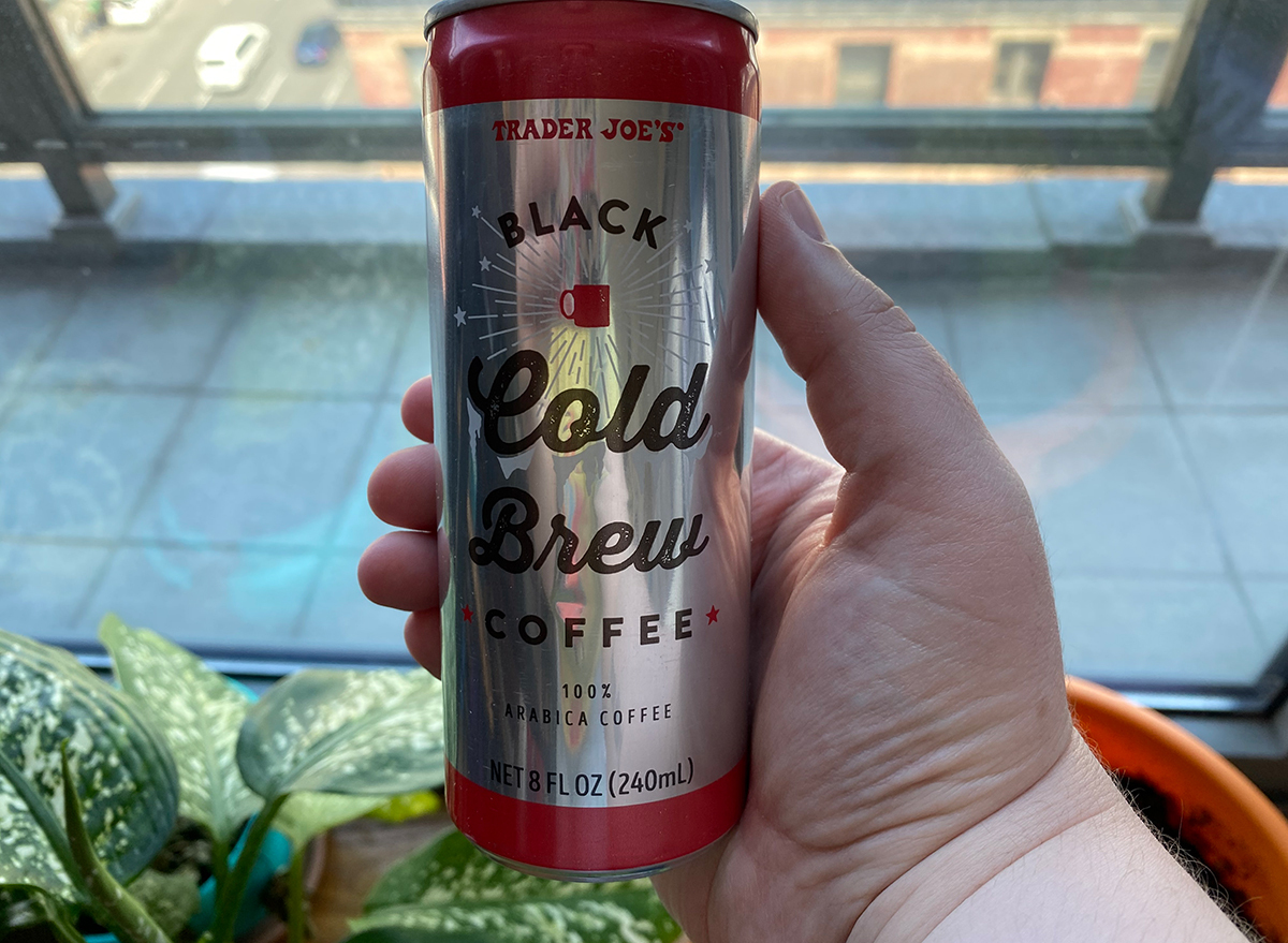 hand holding trader joes cold brew coffee can