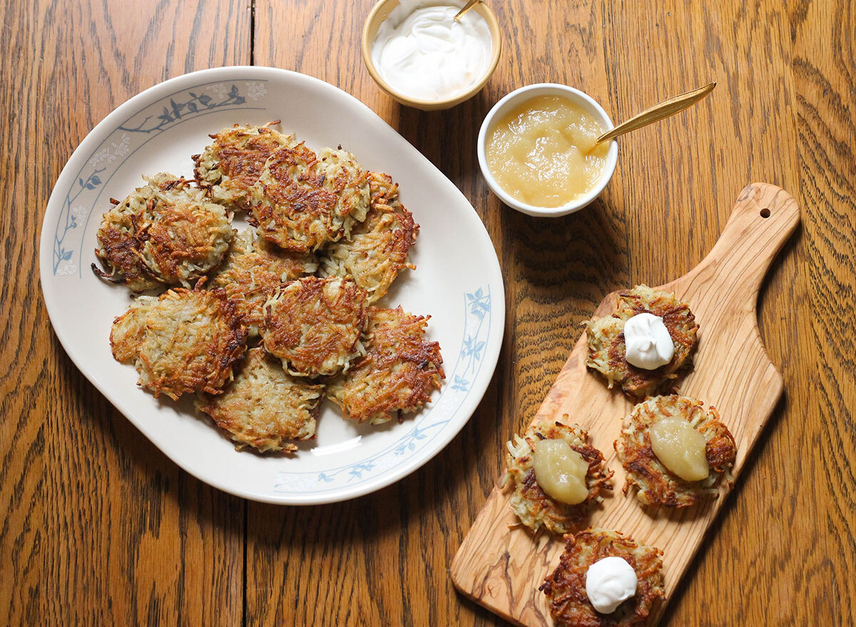 Latkes with sour cream and applesauce ready to be eaten