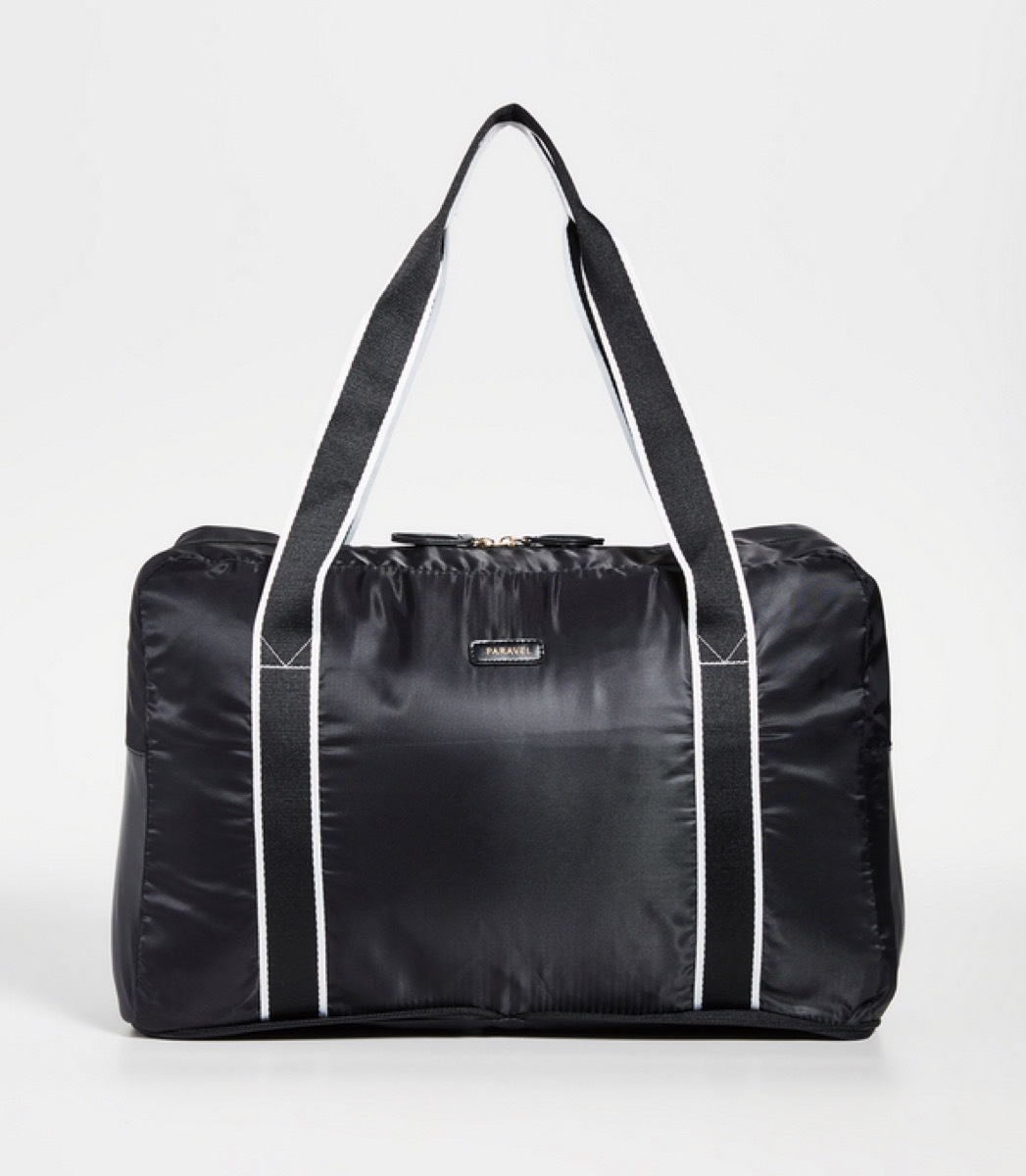 black duffel bag with black and white straps