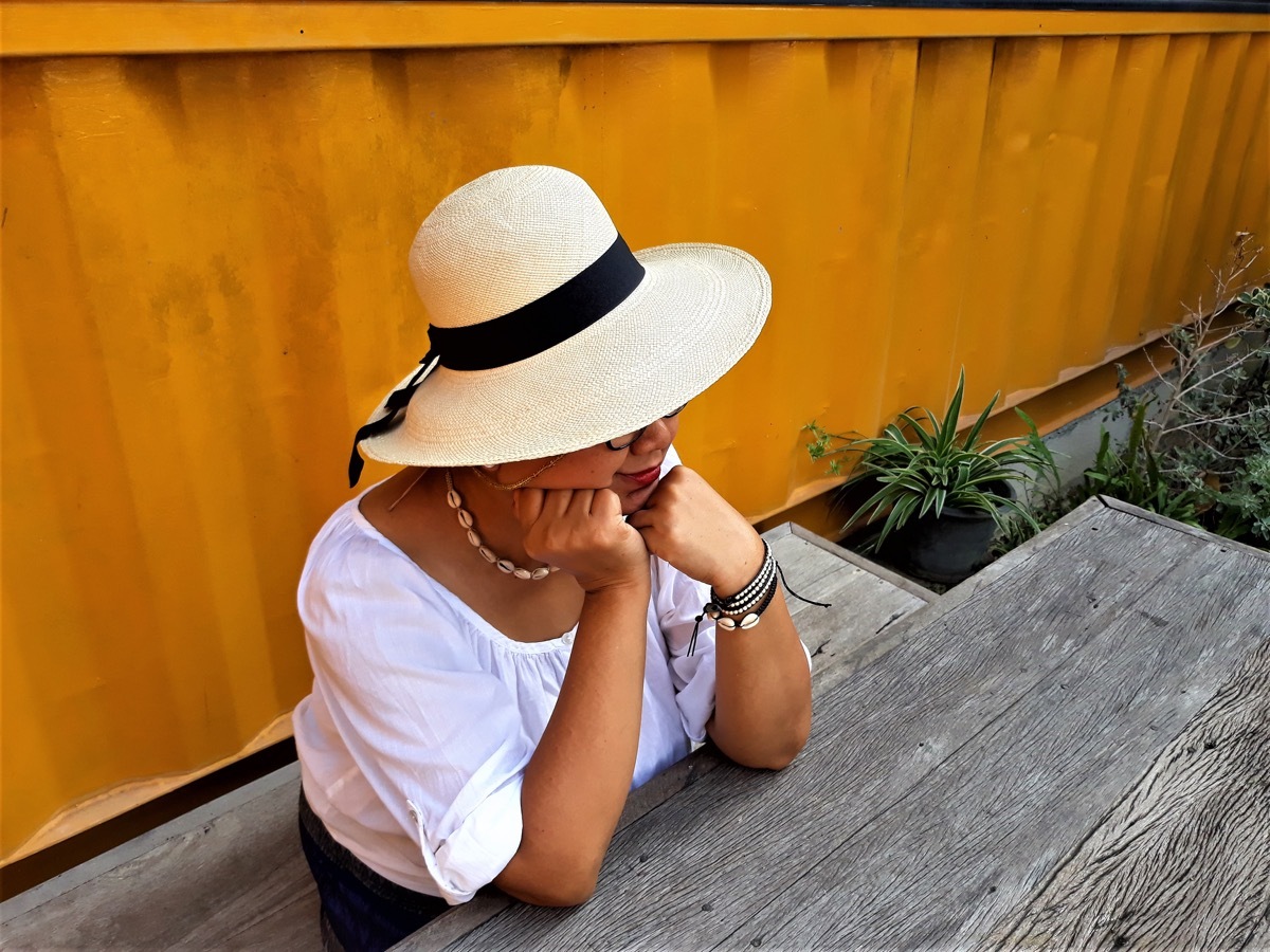 woman with her elbows on table, old-fashioned etiquette rules