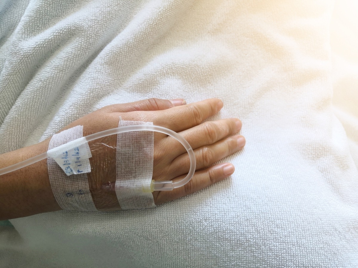 Hand of woman in hospital bed