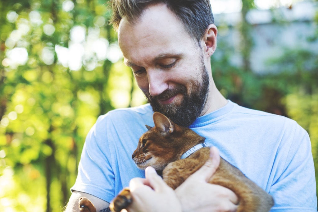 Young man with cat