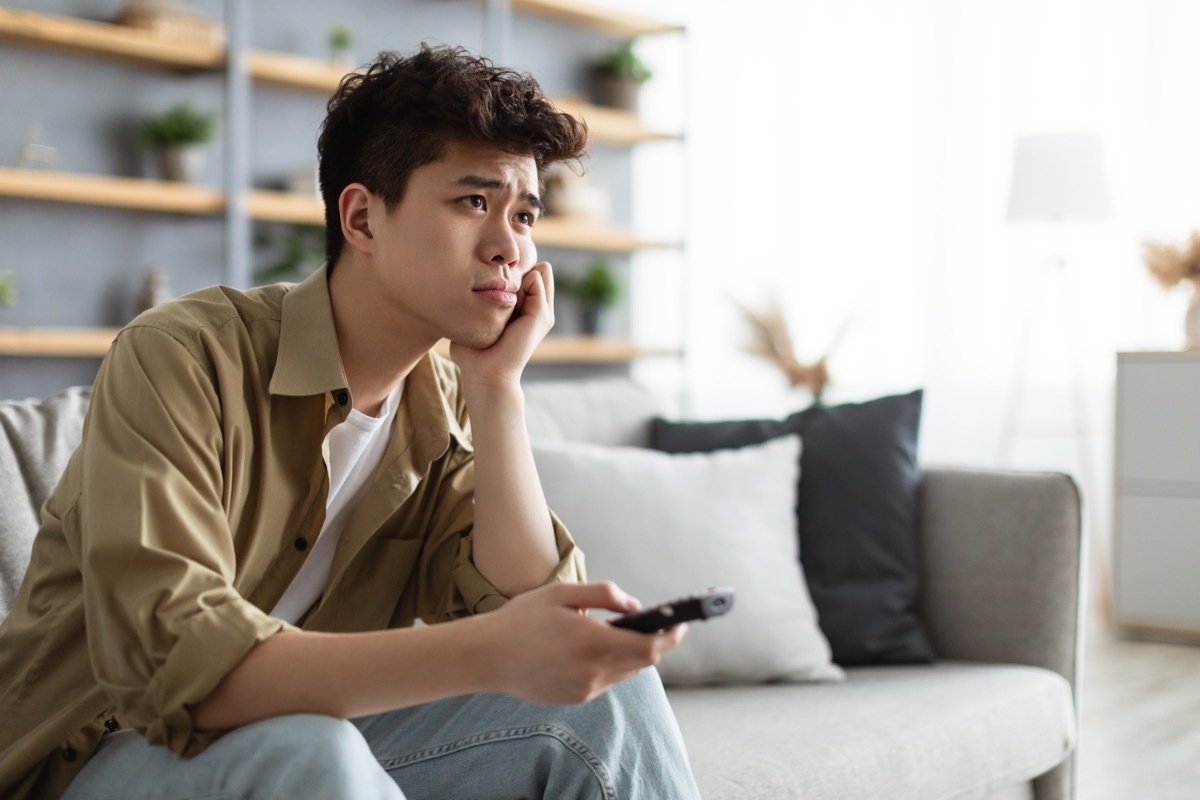 man upset watching tv