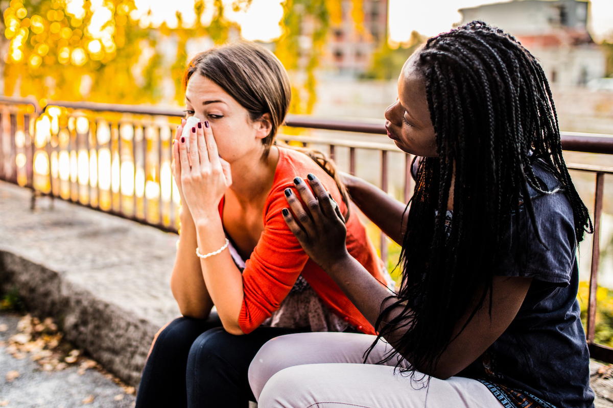 Friend reassuring sad friend