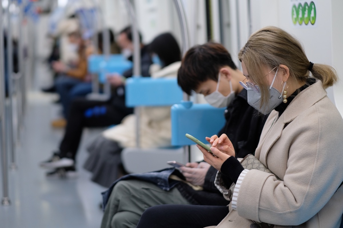 People wearing masks on train