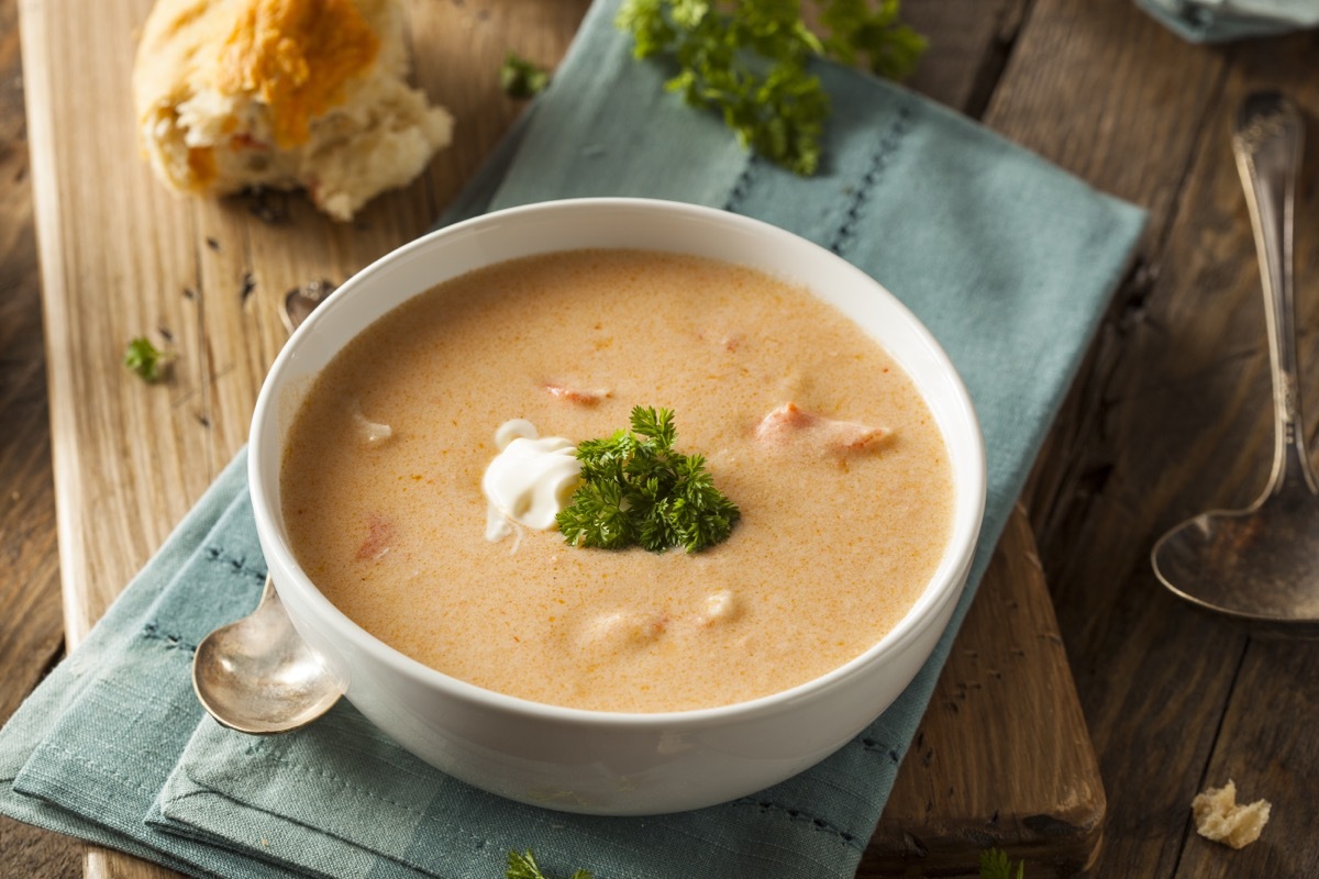 lobster bisque in white bowl on blue napkin