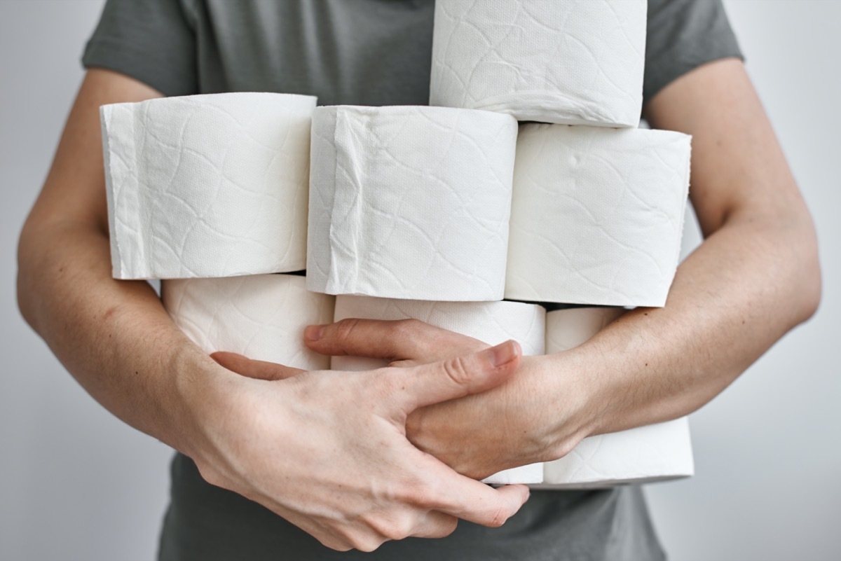 white man holding toilet paper