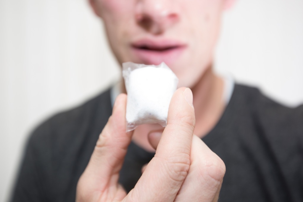 teenage student eating tide pod