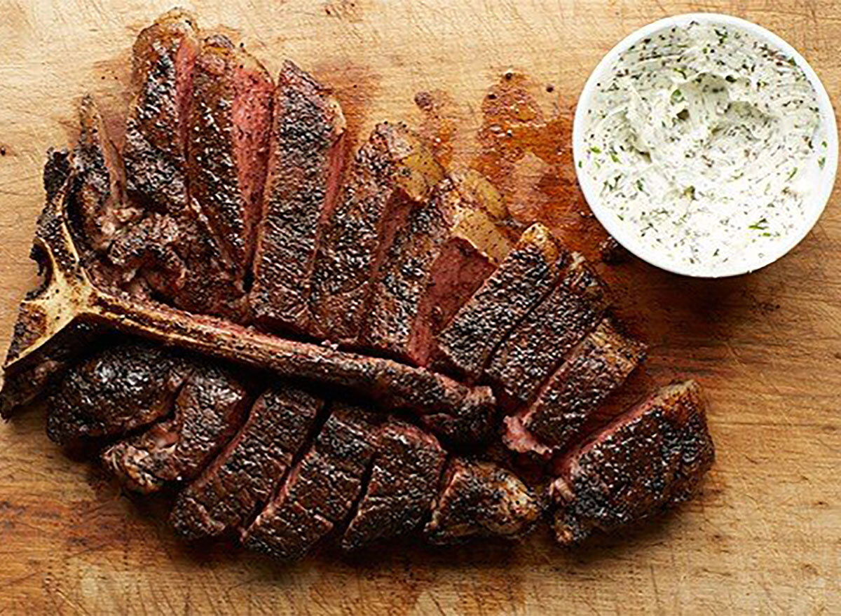 sliced porterhouse steak with garlic butter