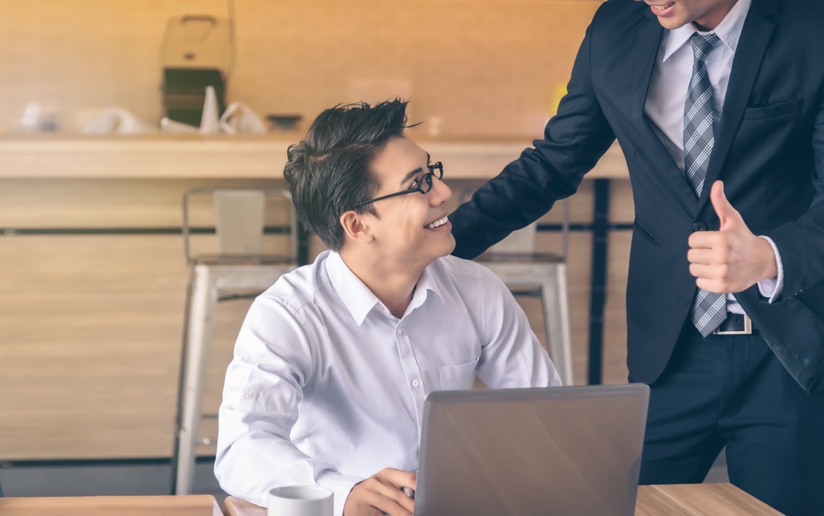 man receiving a compliment from work