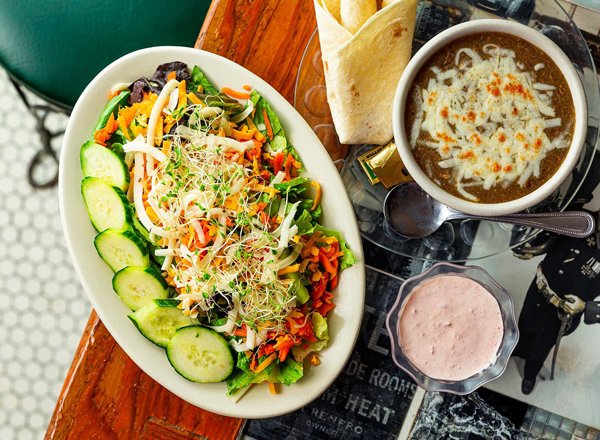 salad with bowl of chili and strawberry milkshake