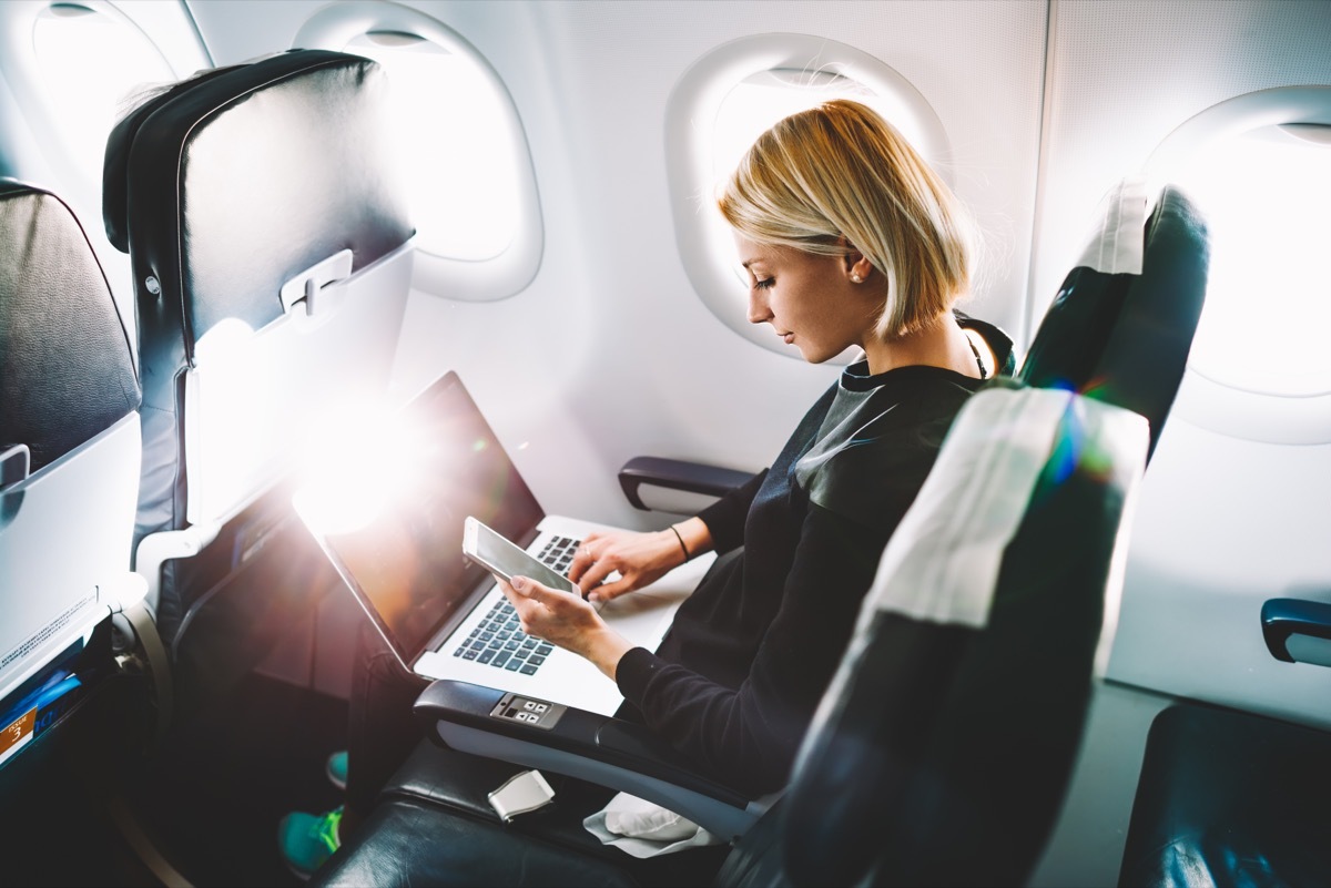 woman flying business class