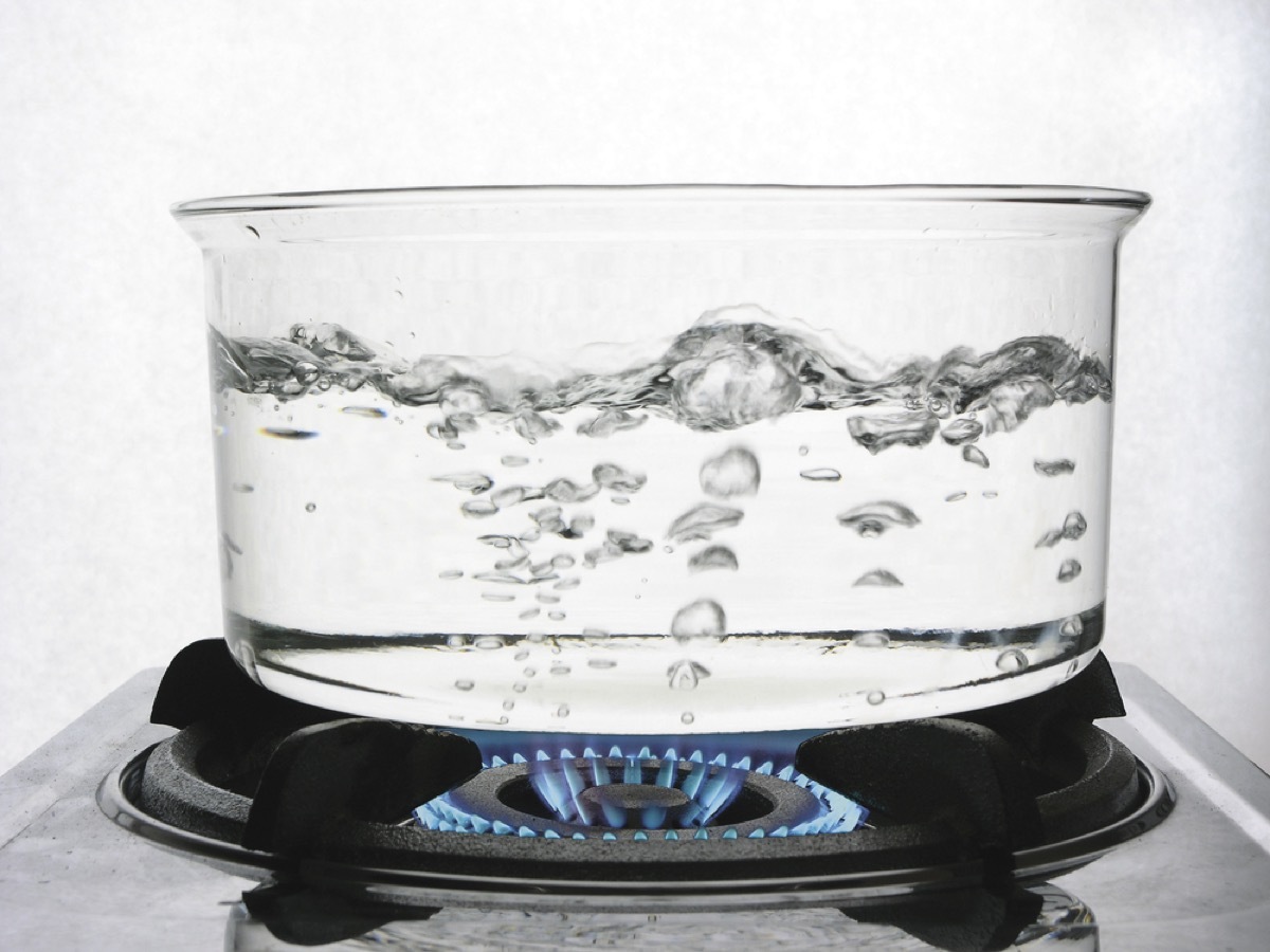 close up of boiling water in clear pan