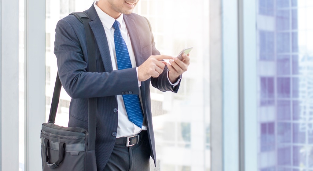 Businessman checking his smartphone