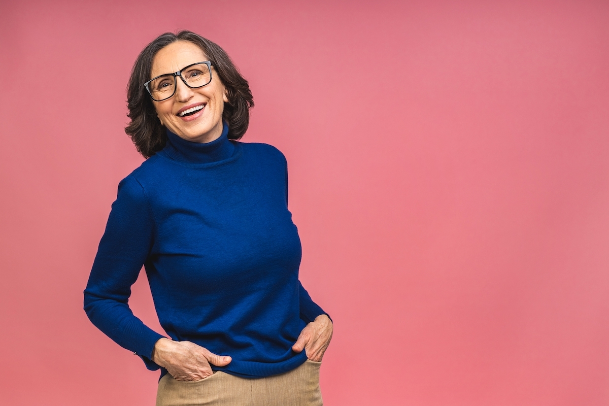 Older woman in blue turtleneck sweater