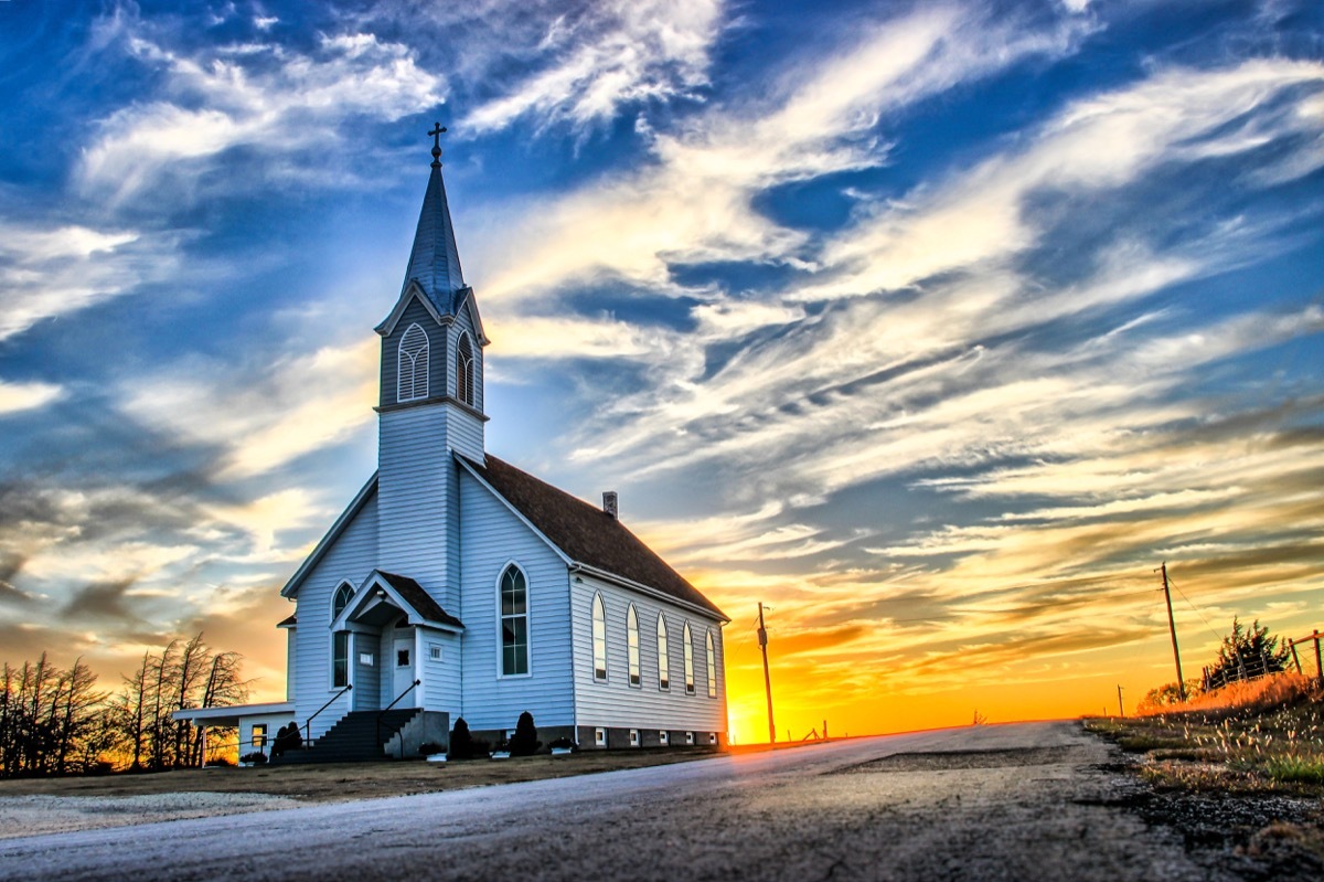 midwest prairie in kansas, church and sunset