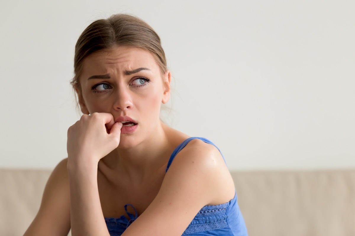 headshot of worried young woman