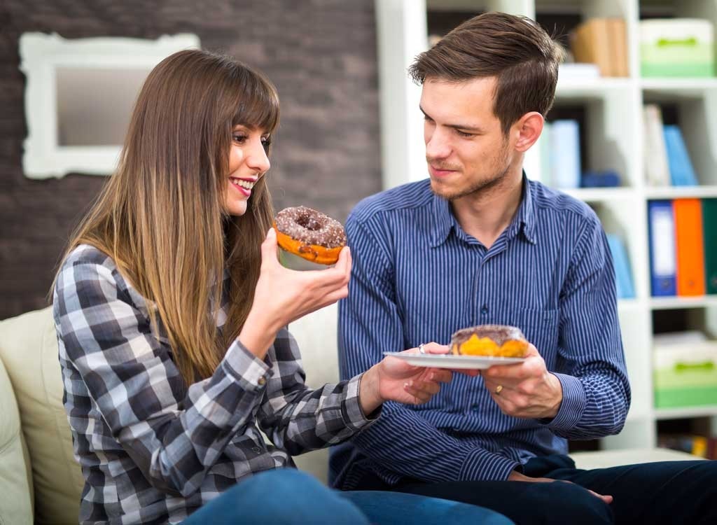 woman holding donut