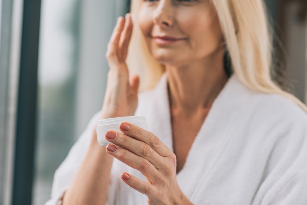 Older Woman Applying Makeup, look better after 40