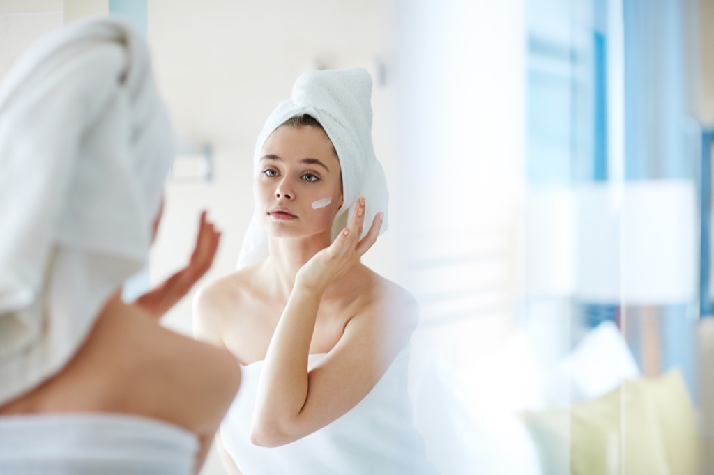 moisturizer woman towel bathroom