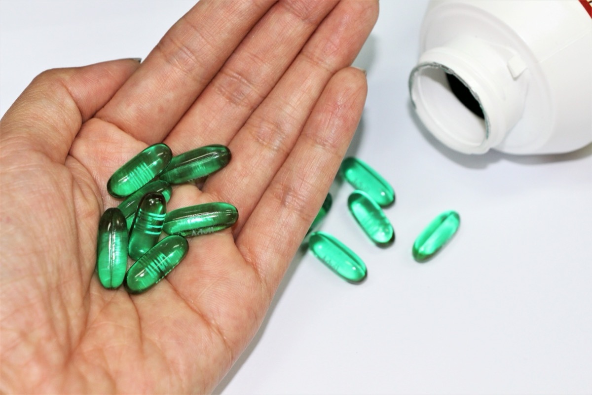 Closeup of woman's hand holding Advil Liqui-Gels