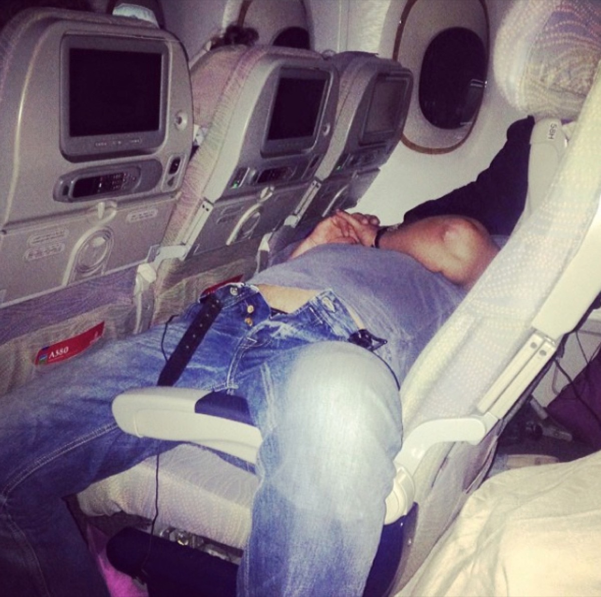 man with pants unbuttoned on airplane photos of terrible airplane passengers