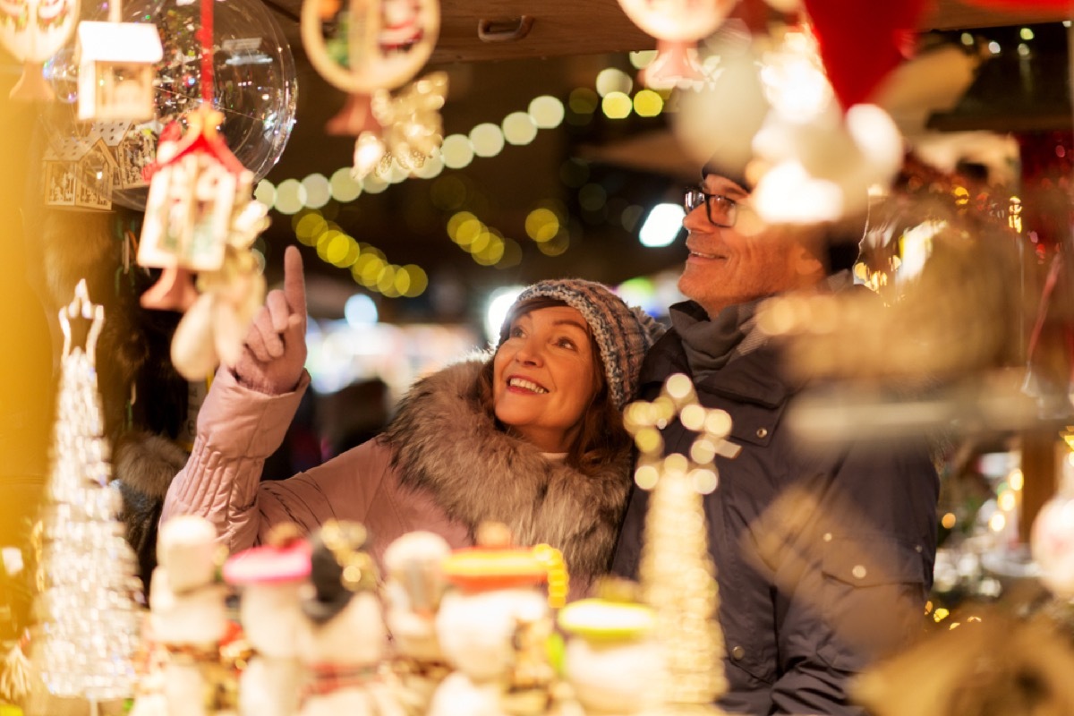 Senior couple shopping at Christmas market