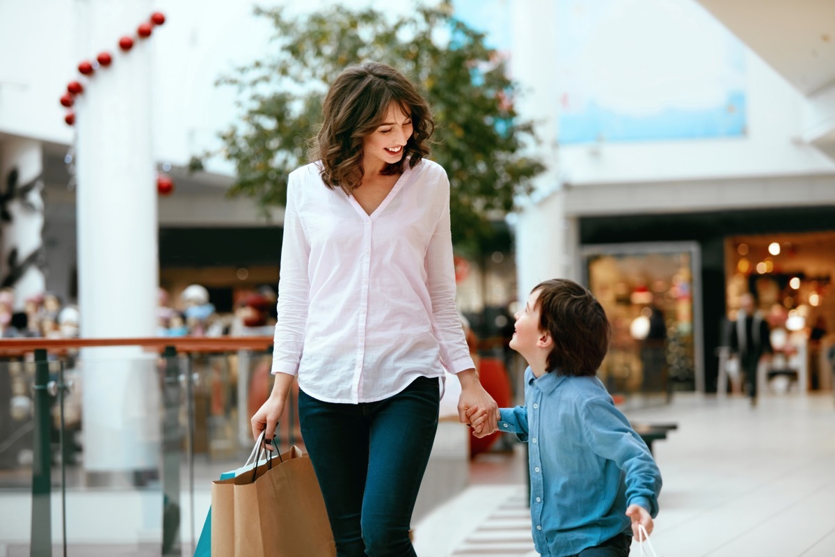 Mom shopping at the mall with her son