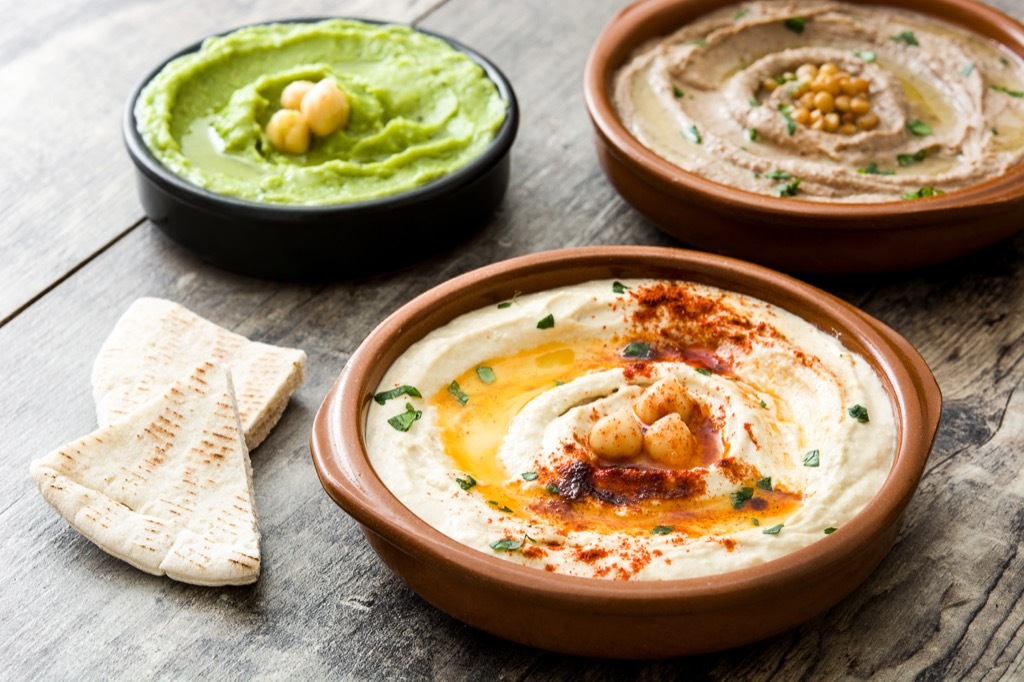 three bowls of hummus