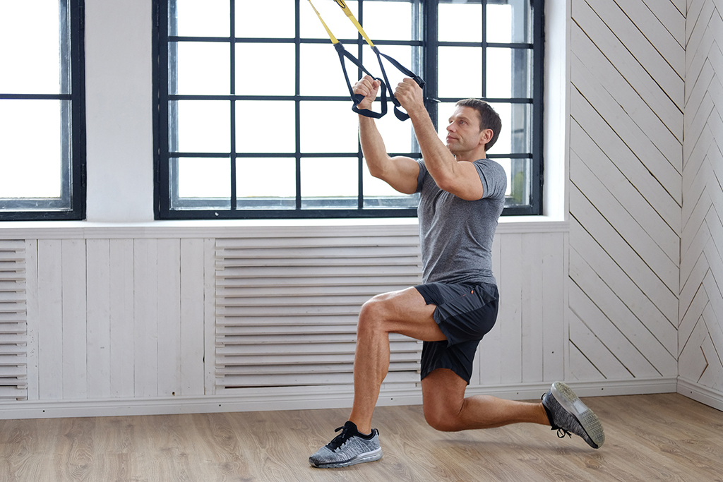 man exercising with pull-down bands