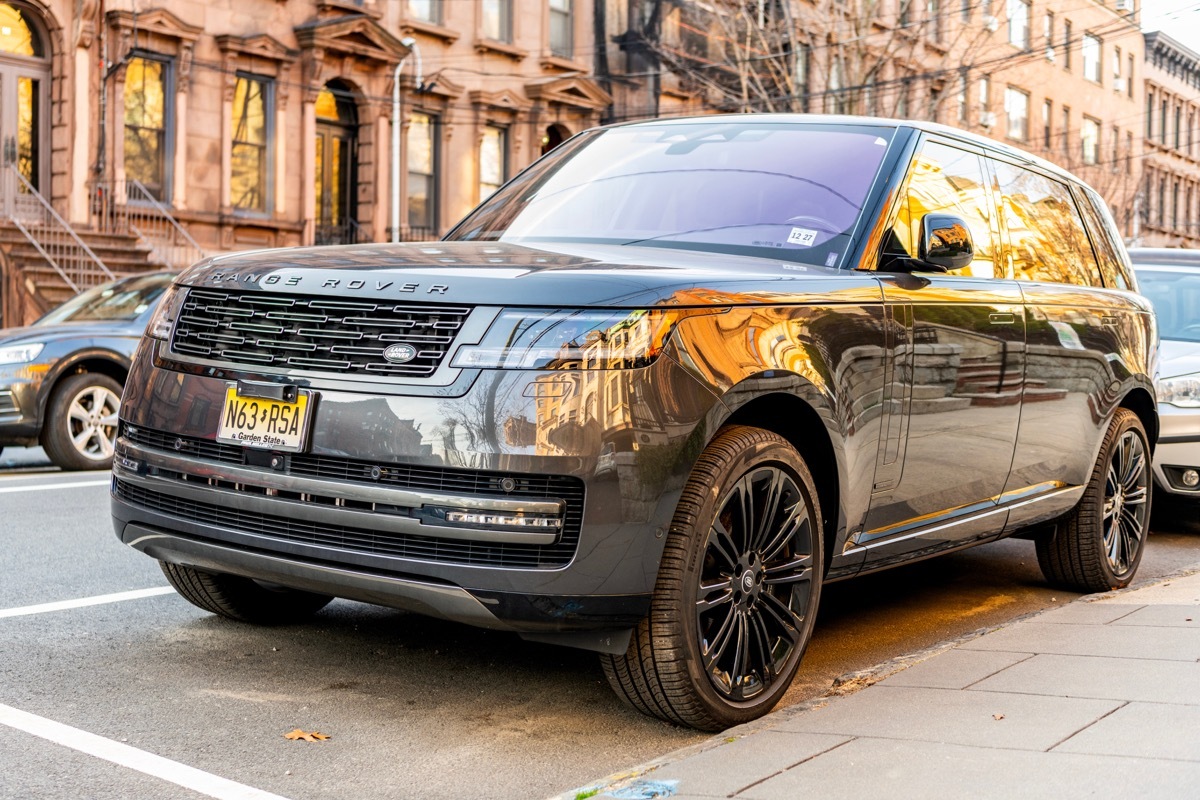 Land Rover Range Rover modern car parked in the street, corner view