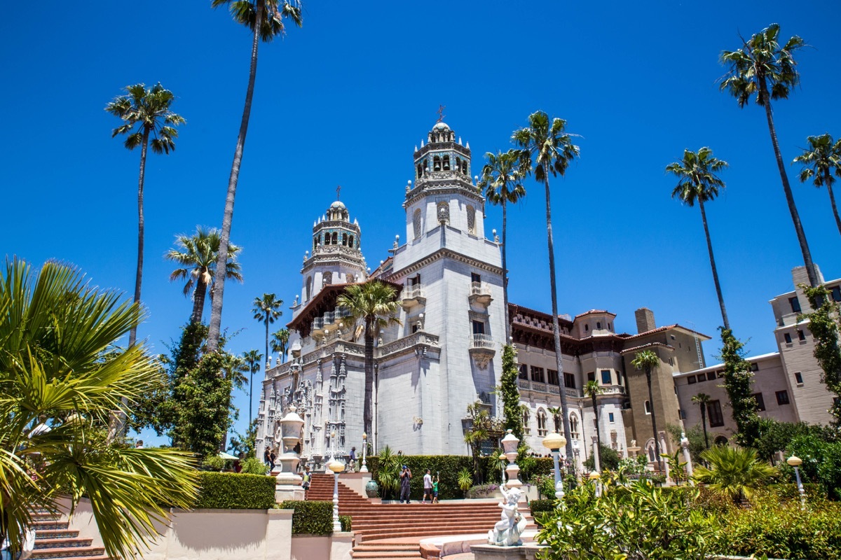 hearst castle with palm trees