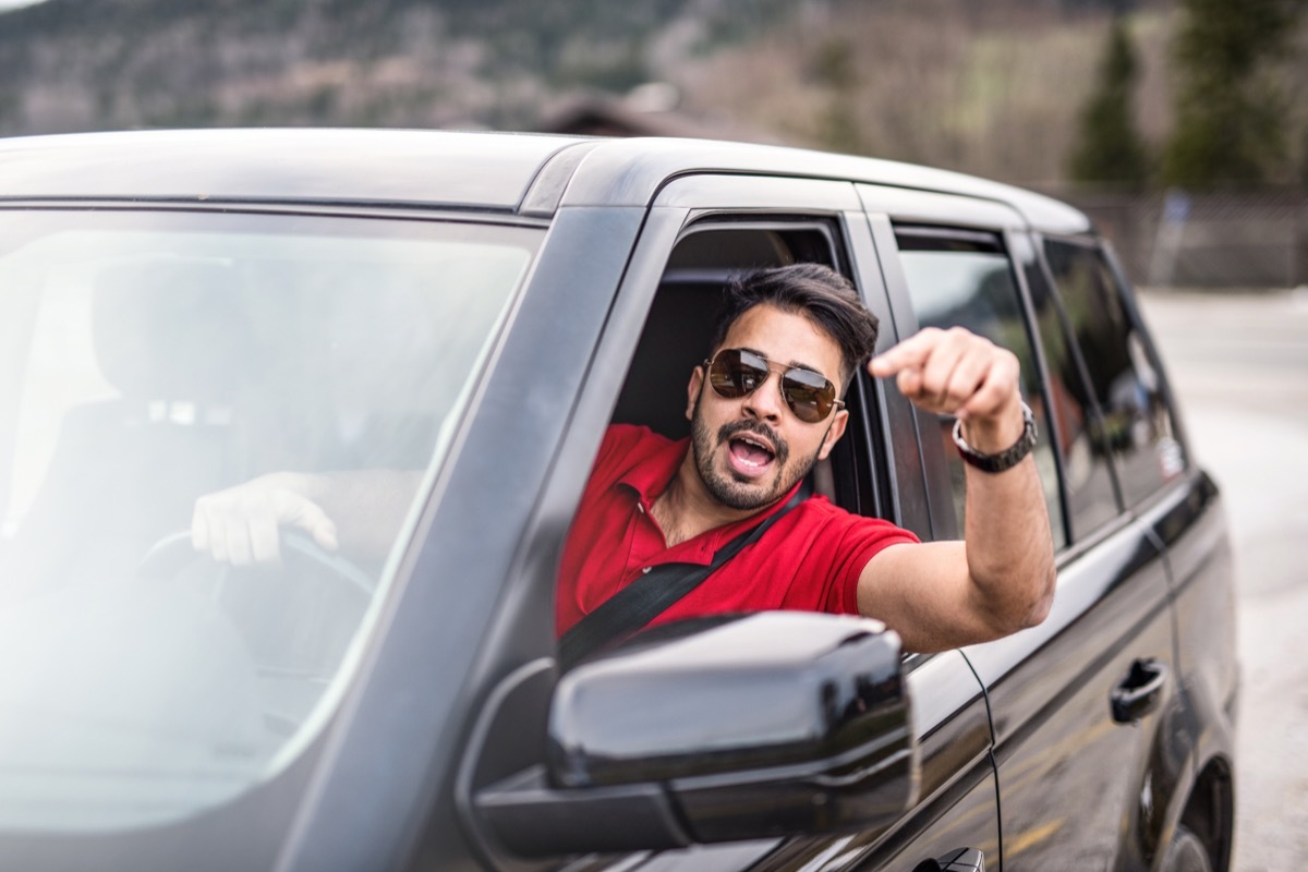 man yelling at traffic