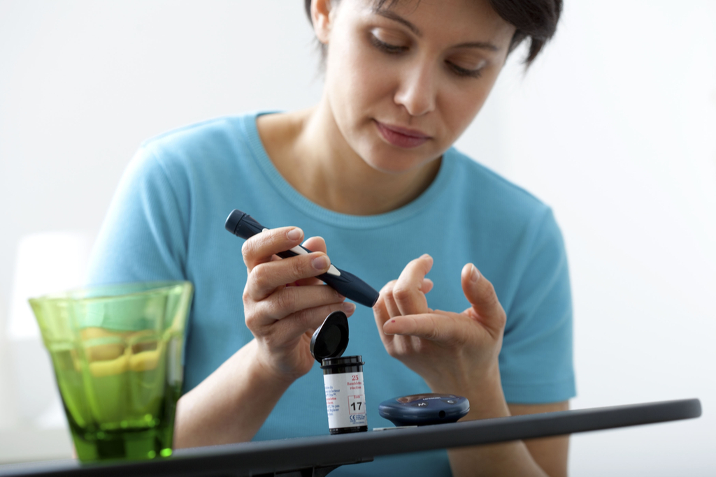 woman testing blood How Depression Affects the Body