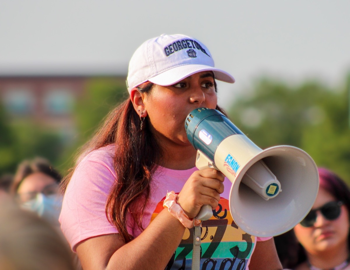 Woman Speaking into Megaphone