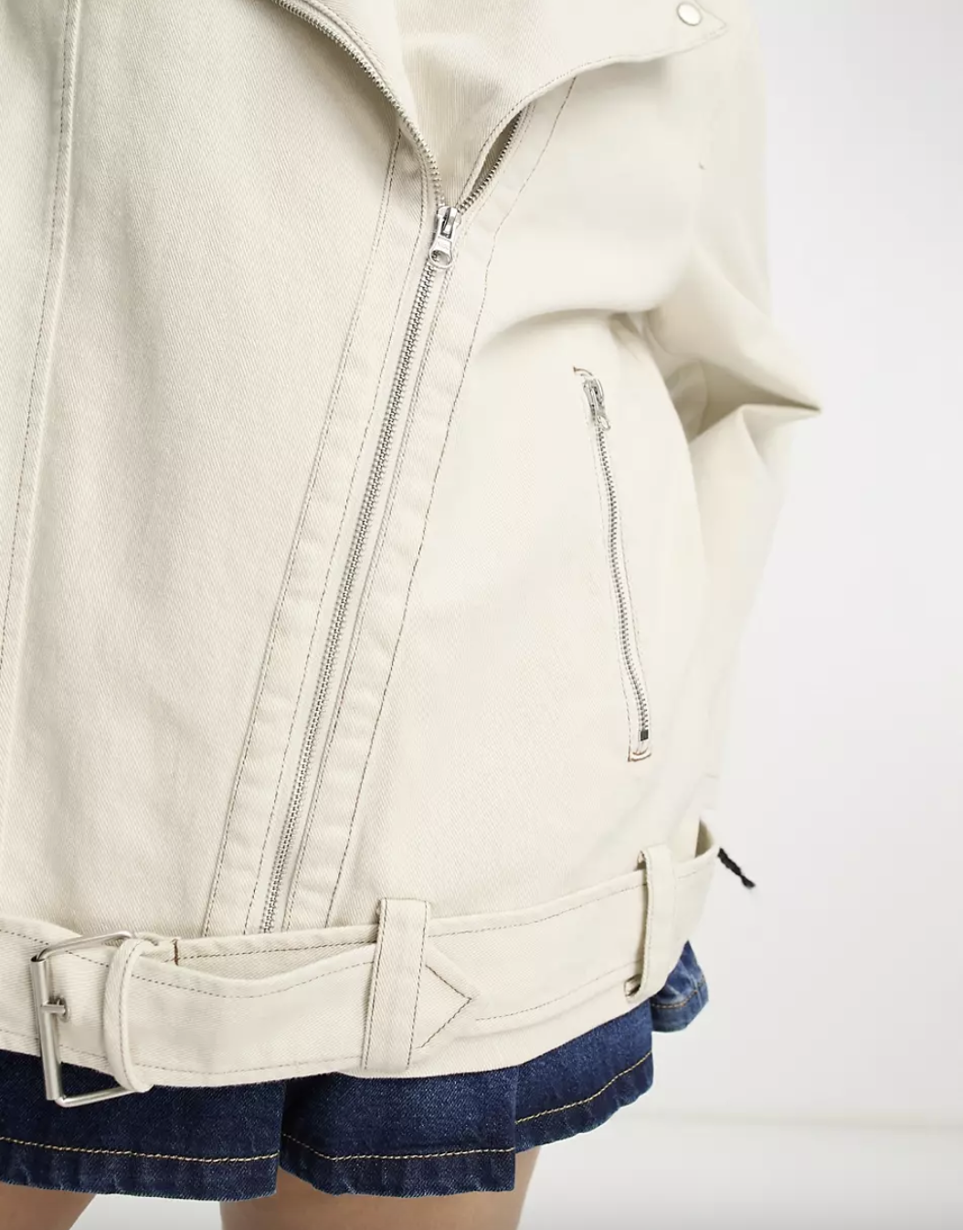 close up model shot of Asos' beige moto jacket