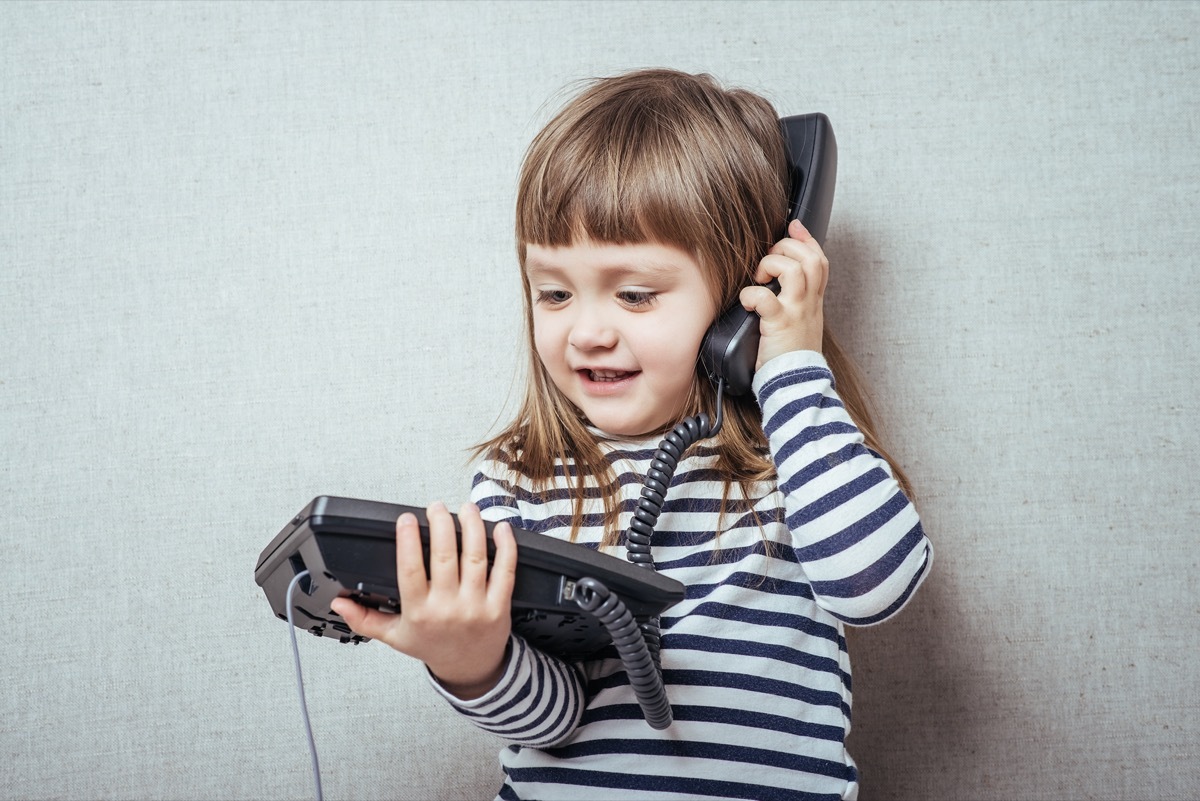 little girl on a phone