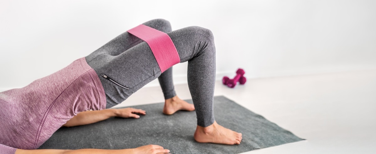 woman training on yoga mat