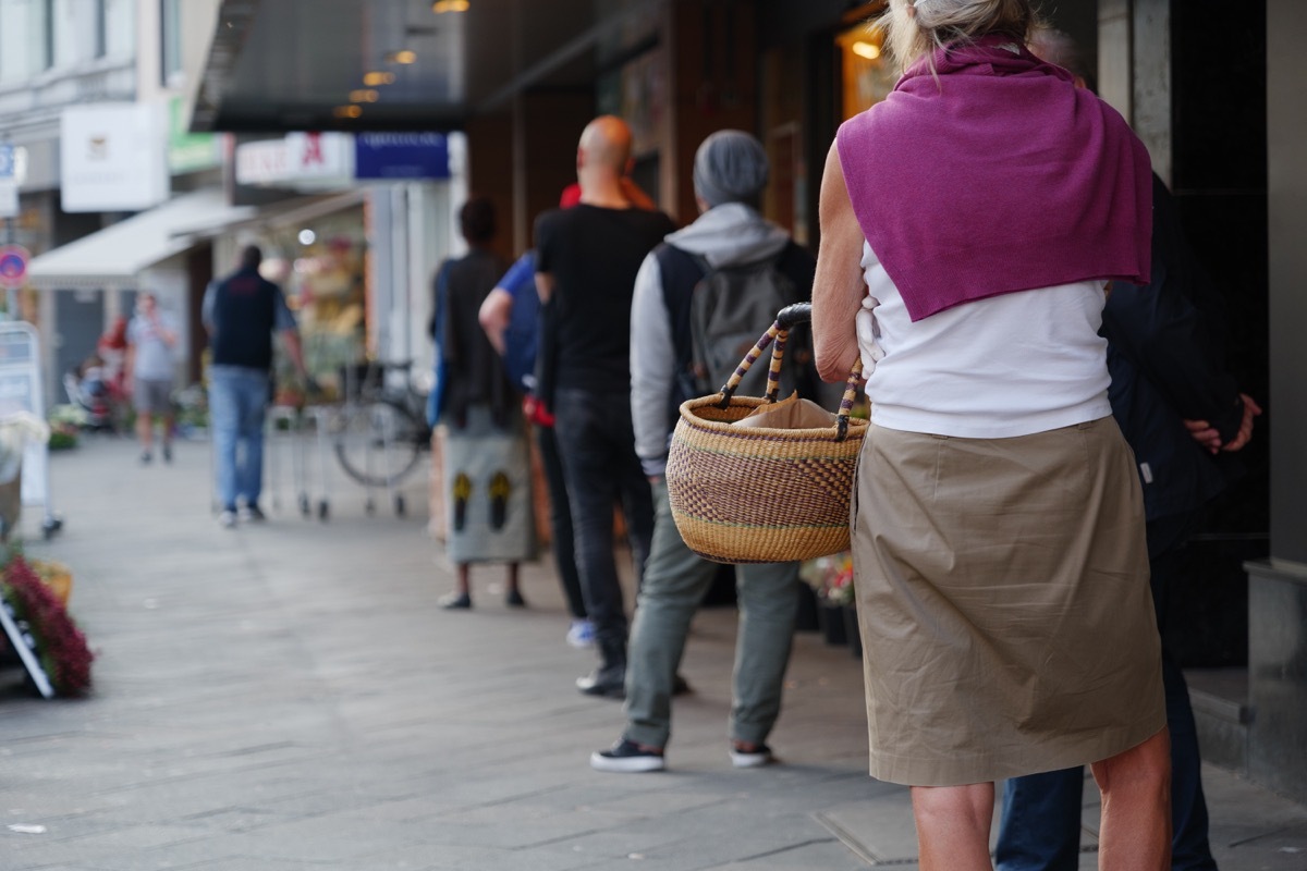 People waiting on line socially distanced