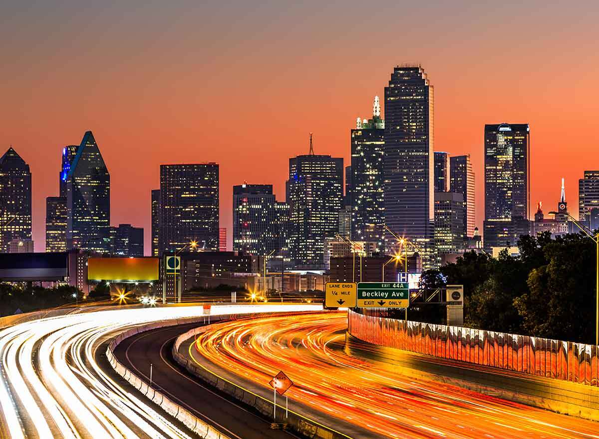 traffic on a highway into dallas at night