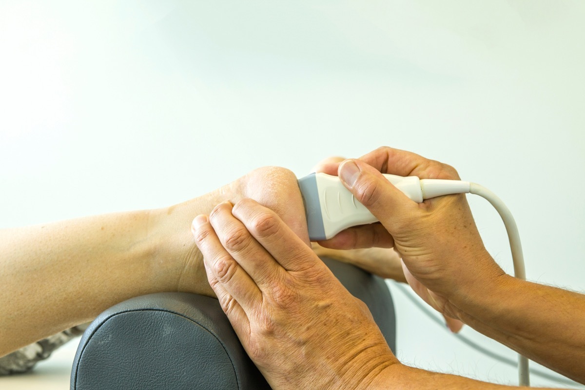 Woman Getting a Heel Exam Aching Feet foot pain