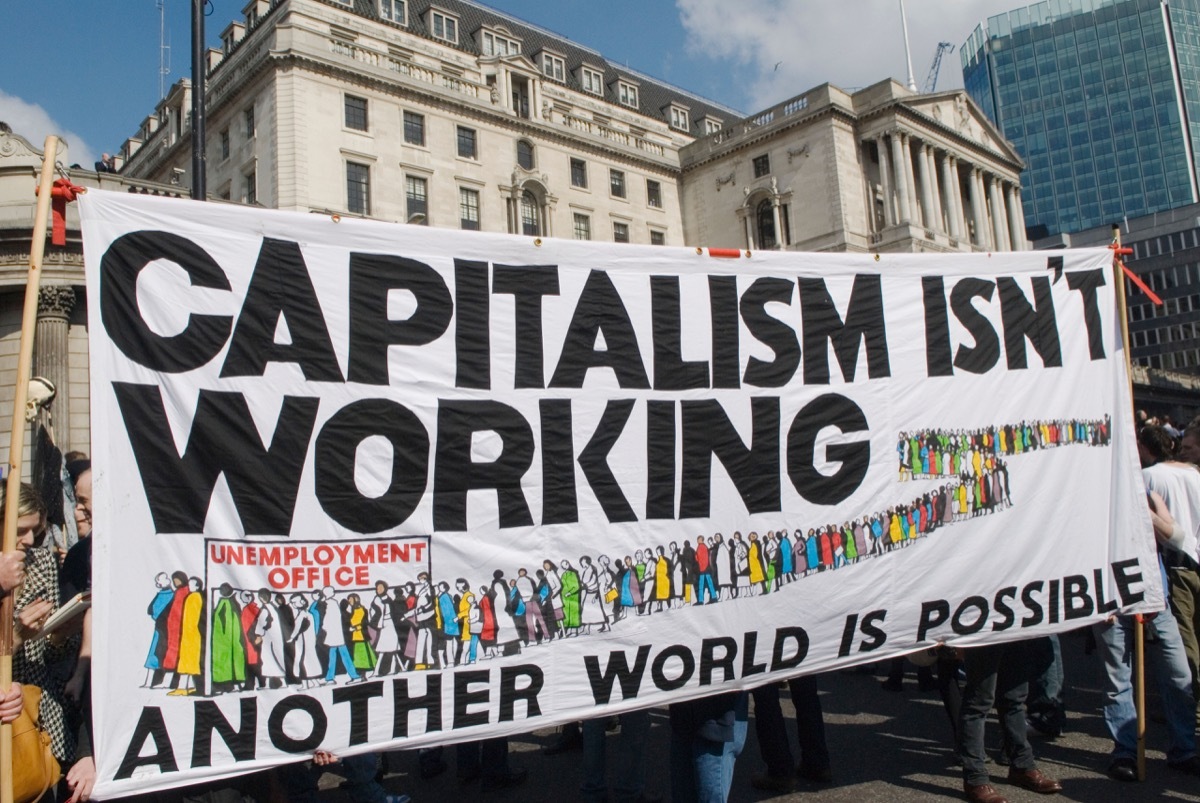 G20 protest outside Bank of England includes sign that reads 