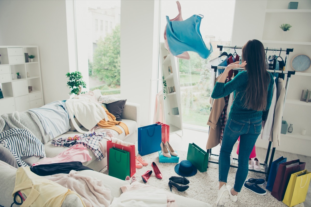 Woman getting rid of clothes